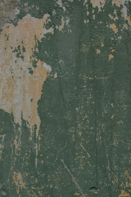 an old and rusty green surface with rust stains