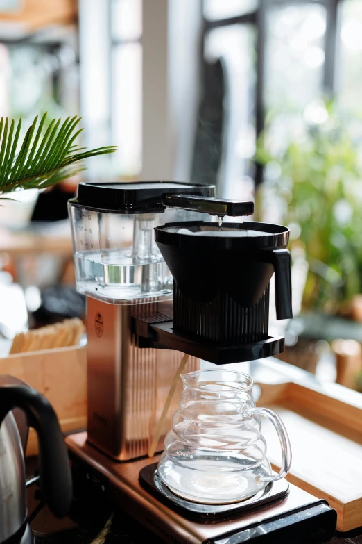 some sort of automatic coffee maker sitting on a table