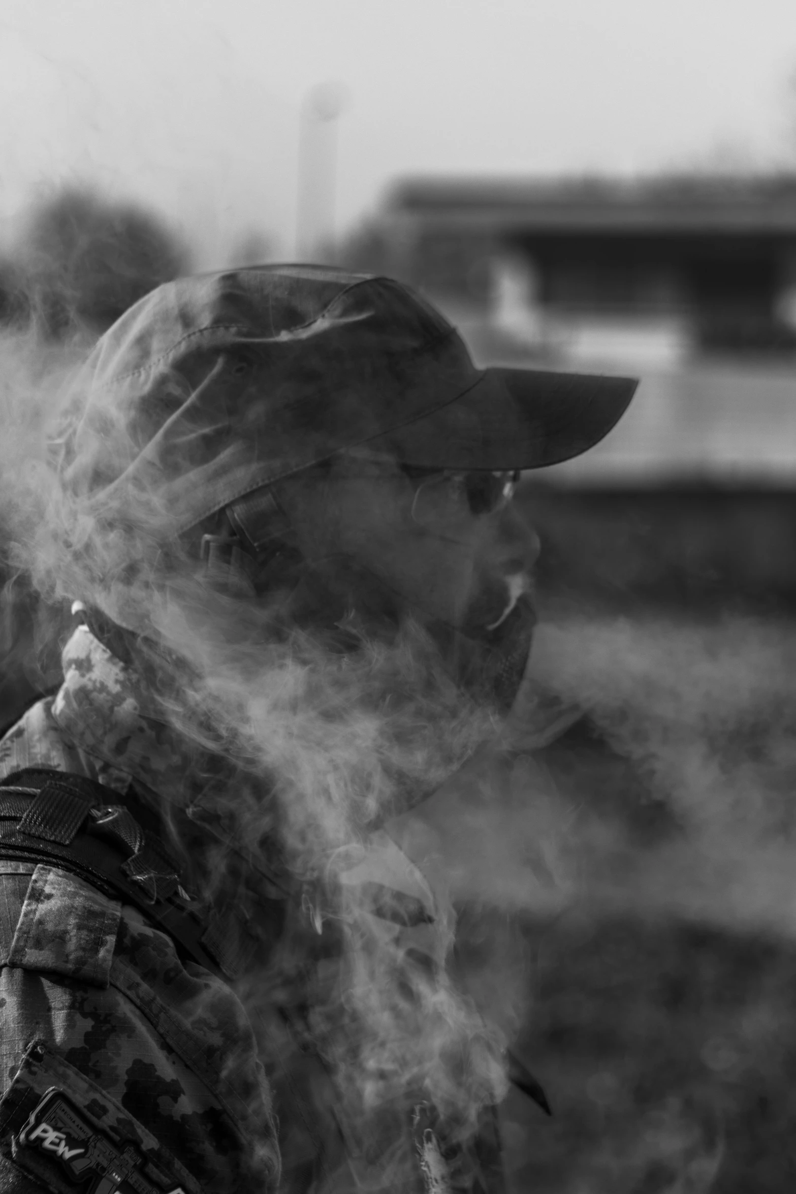 a black and white po of a man smoking a cigarette