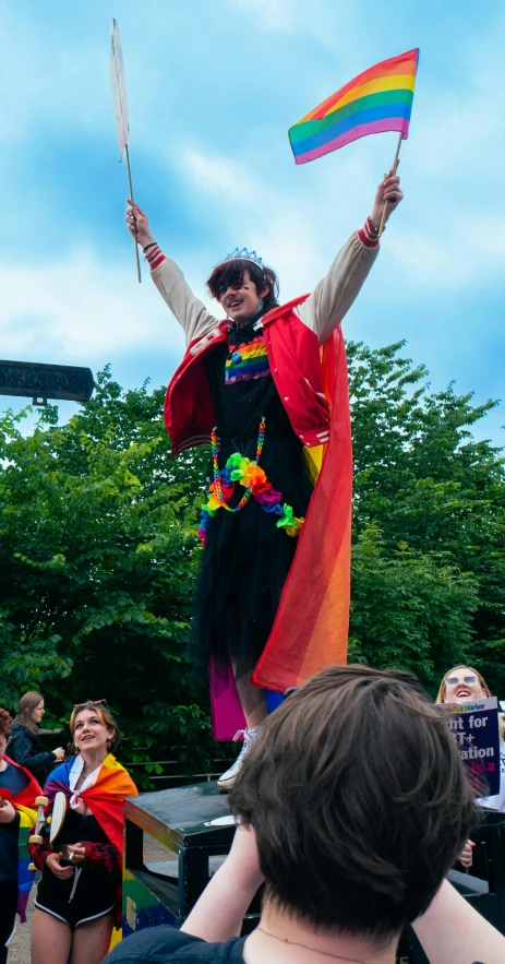 there is a man with a kite standing on top of a platform