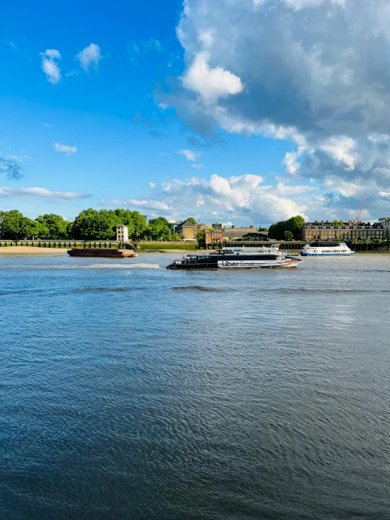 two boats floating on the water during the day