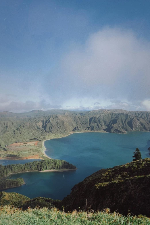 a mountain lake that is surrounded by the land