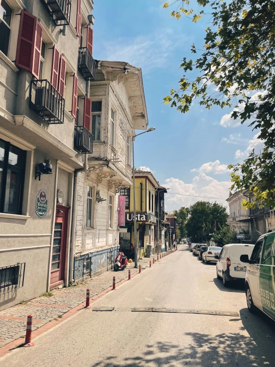 a street view of a building with many windows