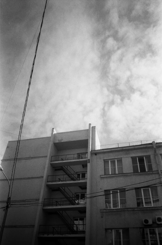 an apartment building with some balconies on top