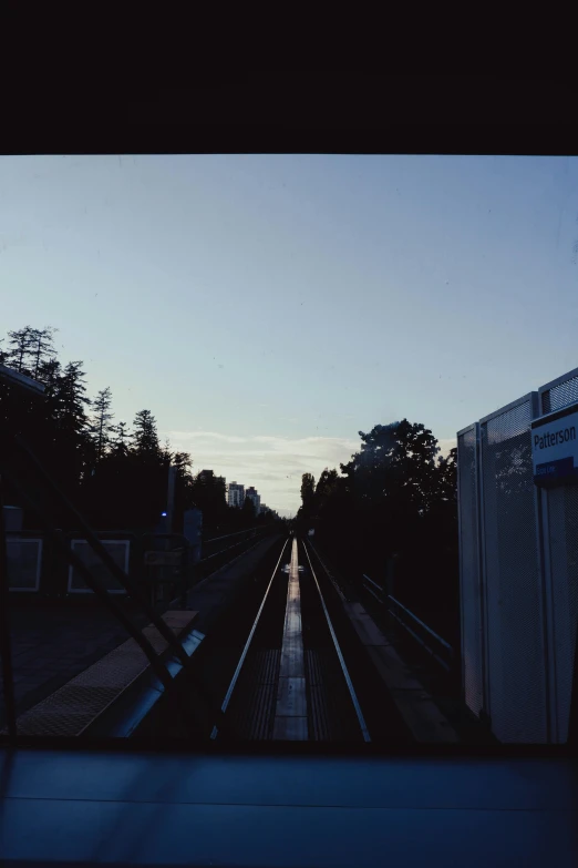 view from inside a train looking at a platform