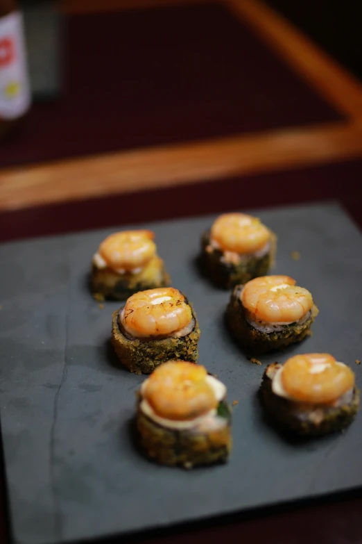 mini appetizers made of bread sitting on top of a counter