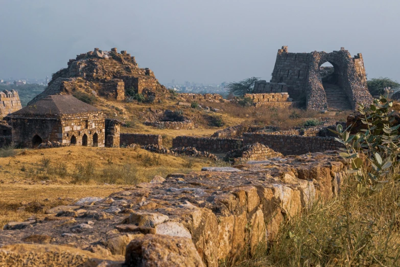 old ruins and grass in an arid field