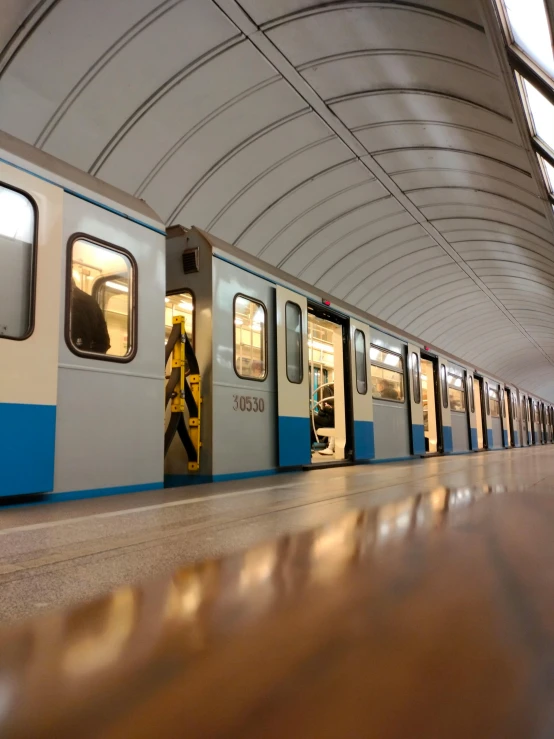 a man is entering the subway from another area