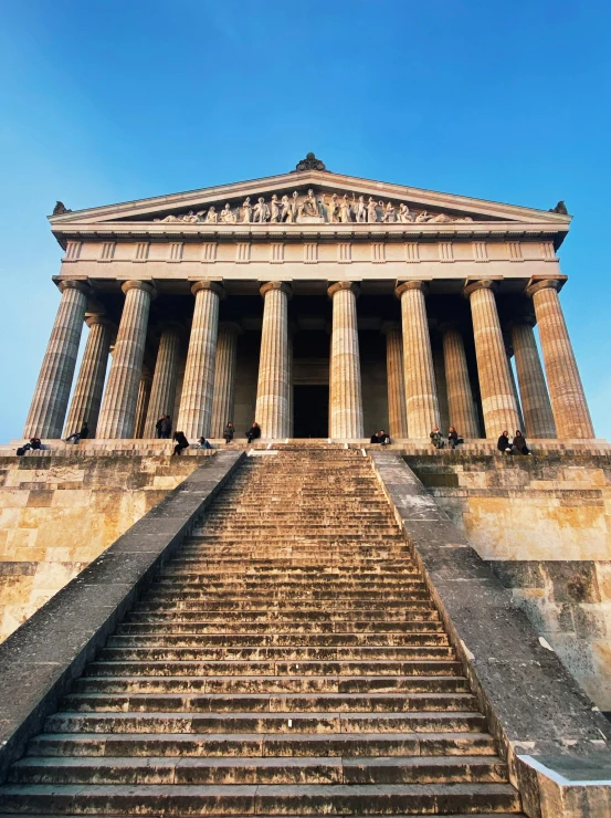 an intricate stone stair case, leading up into the sky