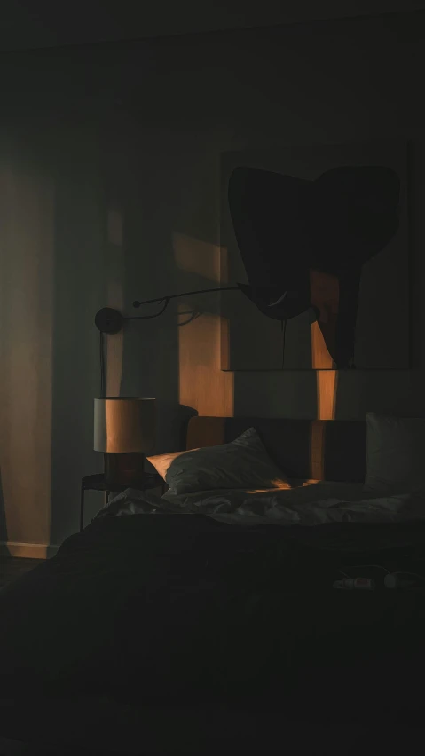 the lamp is on in the bedroom on top of a bed