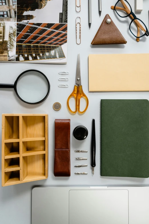 the contents of a travel kit, including glasses and scissors