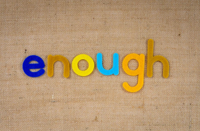 the word enough is made out of plastic letters