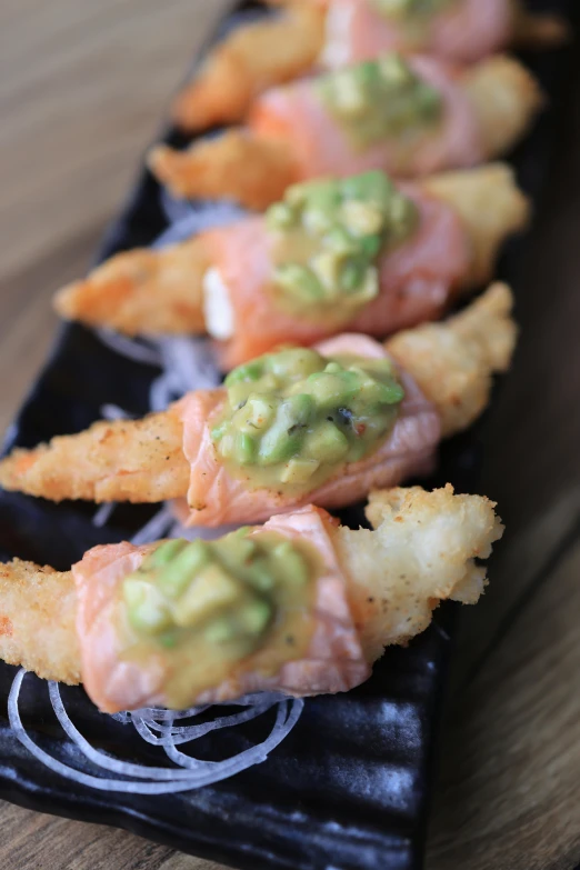 a row of snacks arranged on a plate