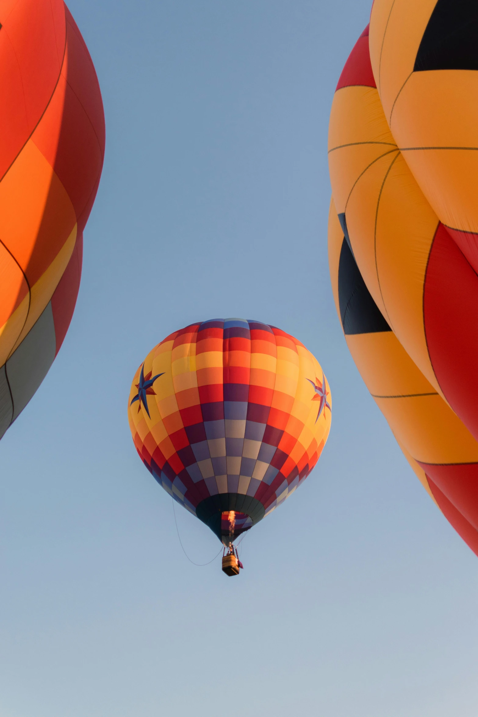 a view of three  air balloons flying in the sky