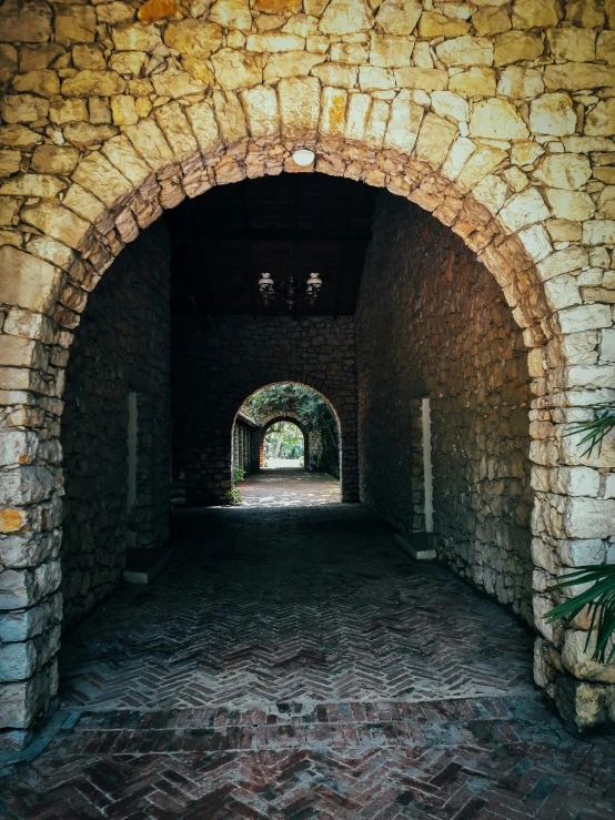 an archway that has a light coming from it