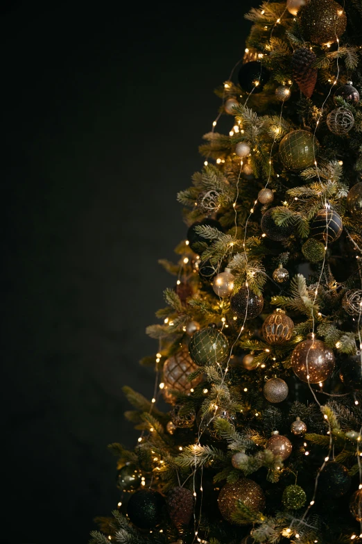 a very large tree with ornaments and lights