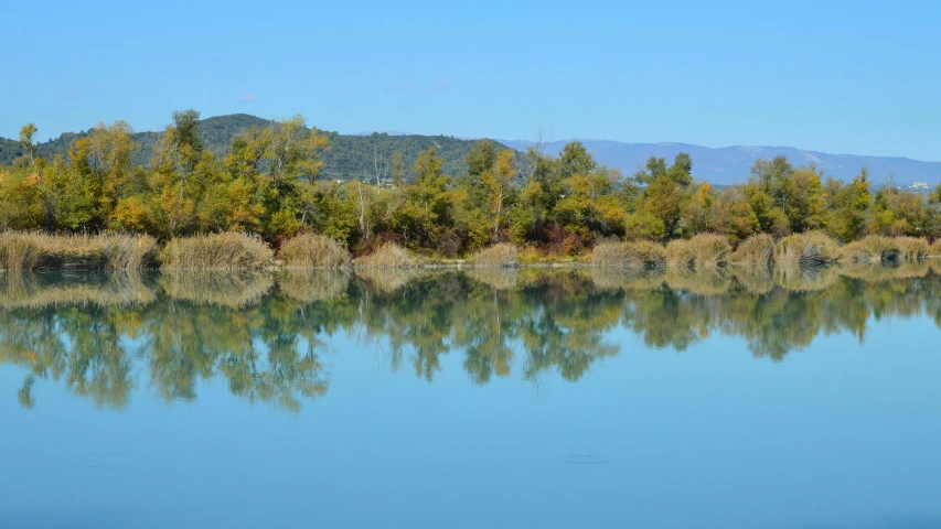 a water body that is next to some hills