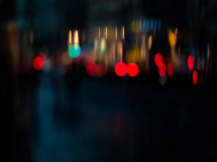 blurry city scene with a bunch of buildings lit up