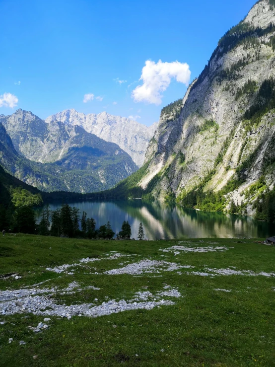 a view from inside a mountain looking at a lake