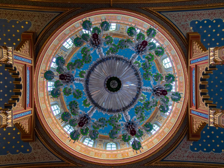 a ceiling that has a large round pattern