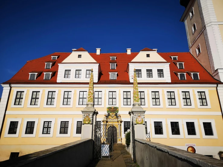 a building with a clock on it with windows