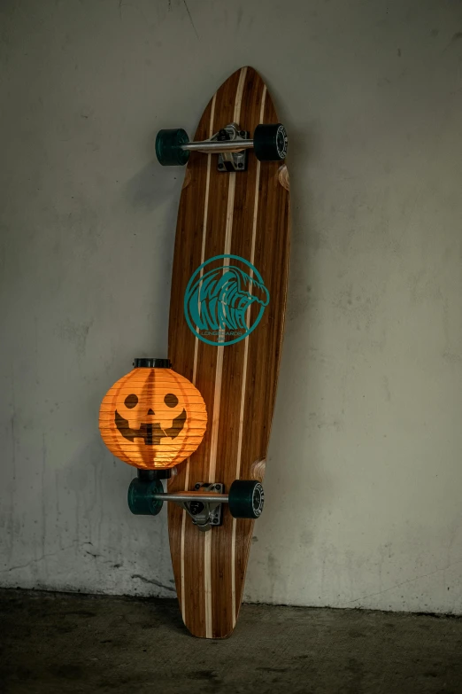 a skateboard with the shape of a pumpkin on it