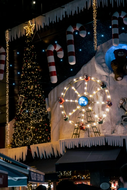 large christmas display at night with lots of lights and decorations