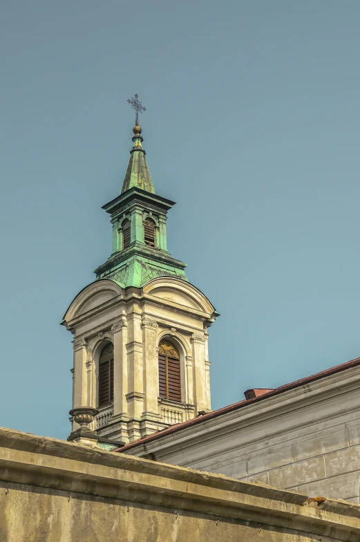 the tower on top of an old building with a clock