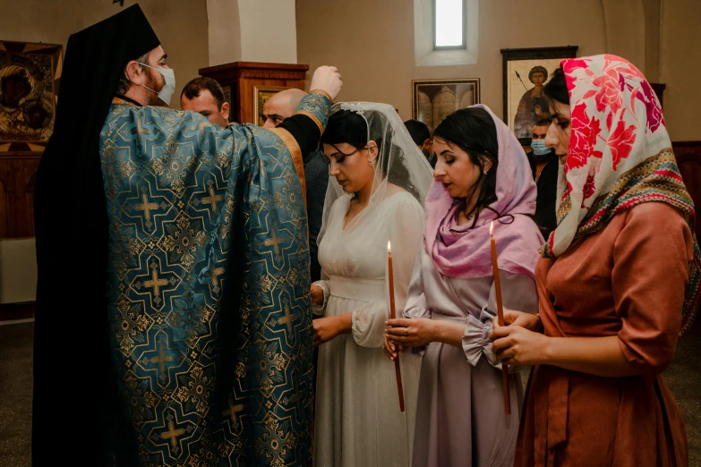 people in robes are standing together during a religious ceremony