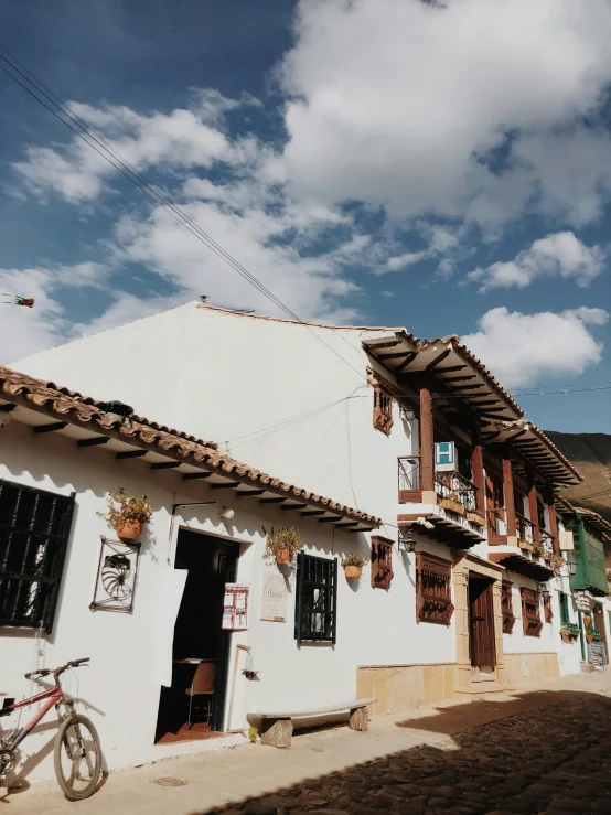 a bicycle sitting next to an old style building