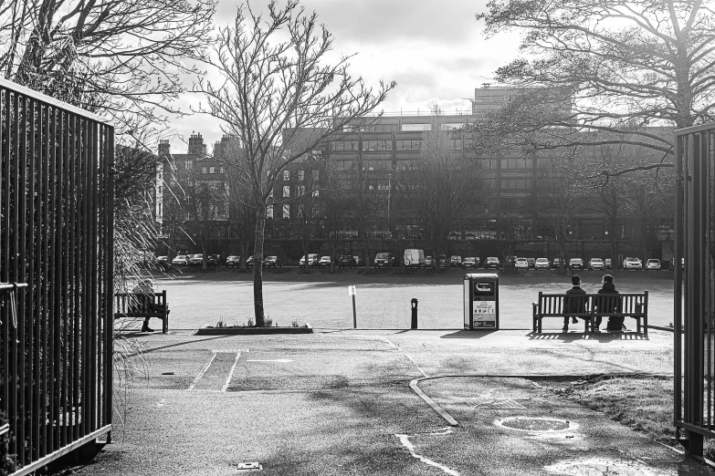 a person sitting on a bench in an open space