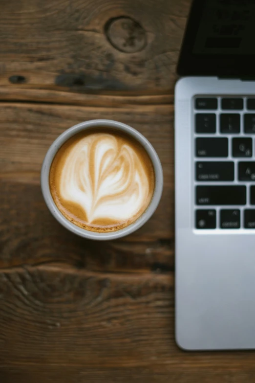 a cup of coffee sitting on top of a table