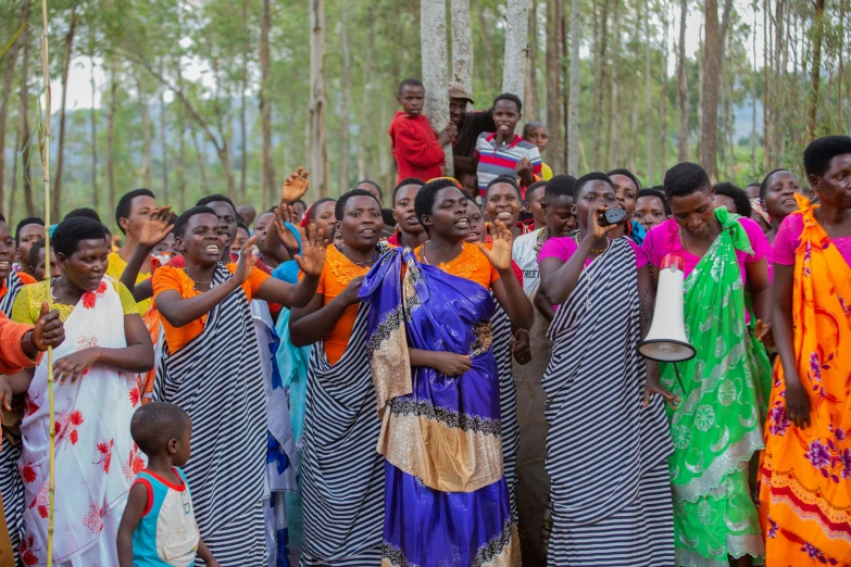 a group of women with a young child on her back