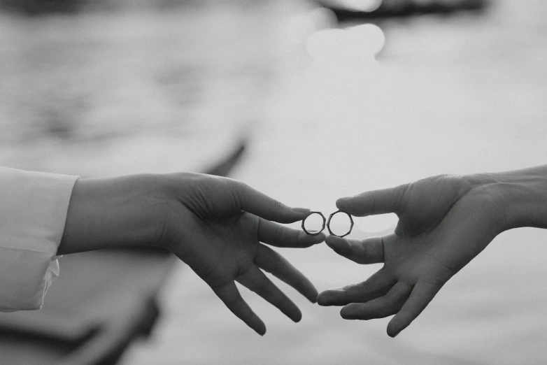 two hands reach out toward each other towards each other