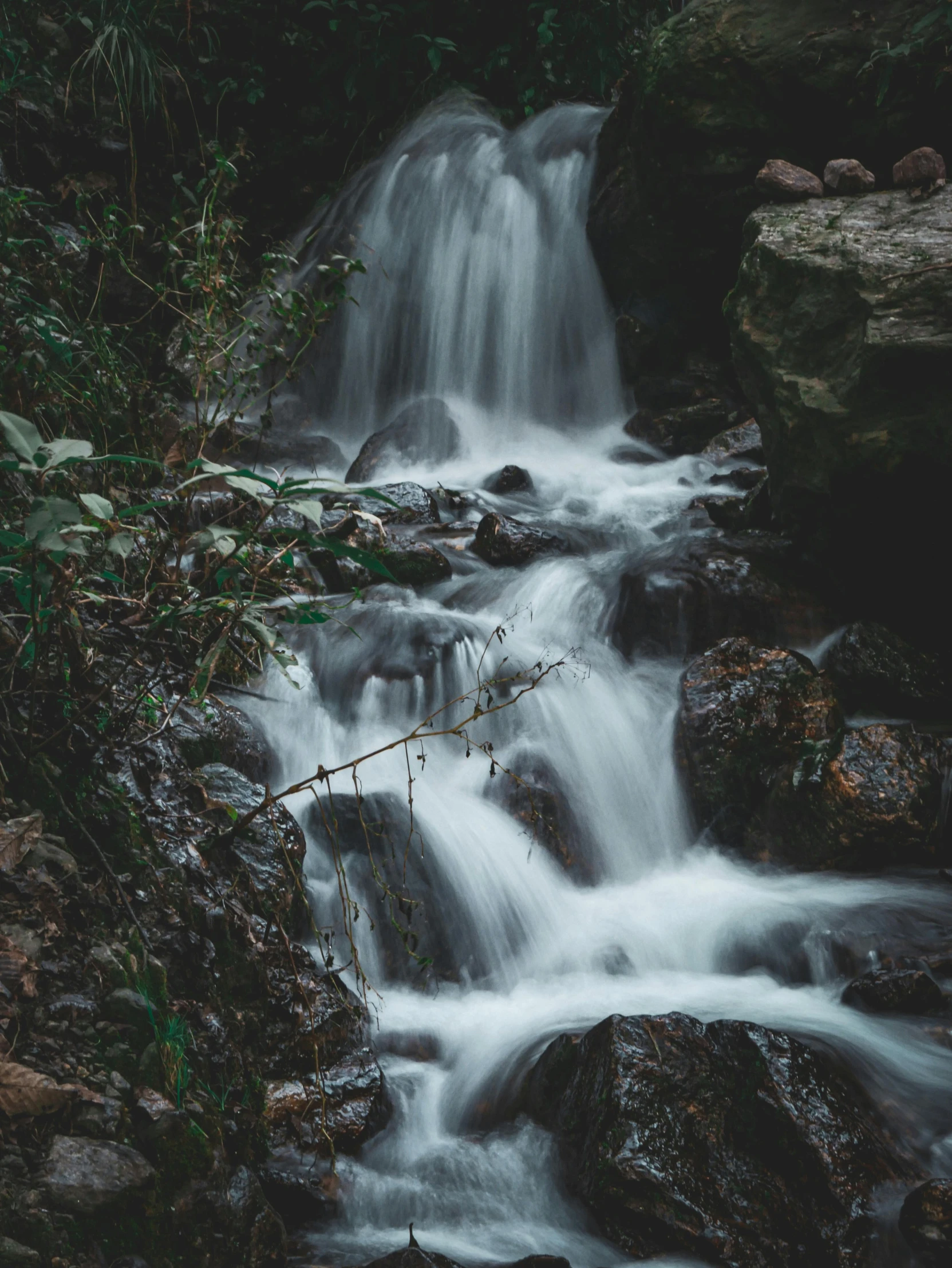 a small waterfall is pictured here in a black and white po