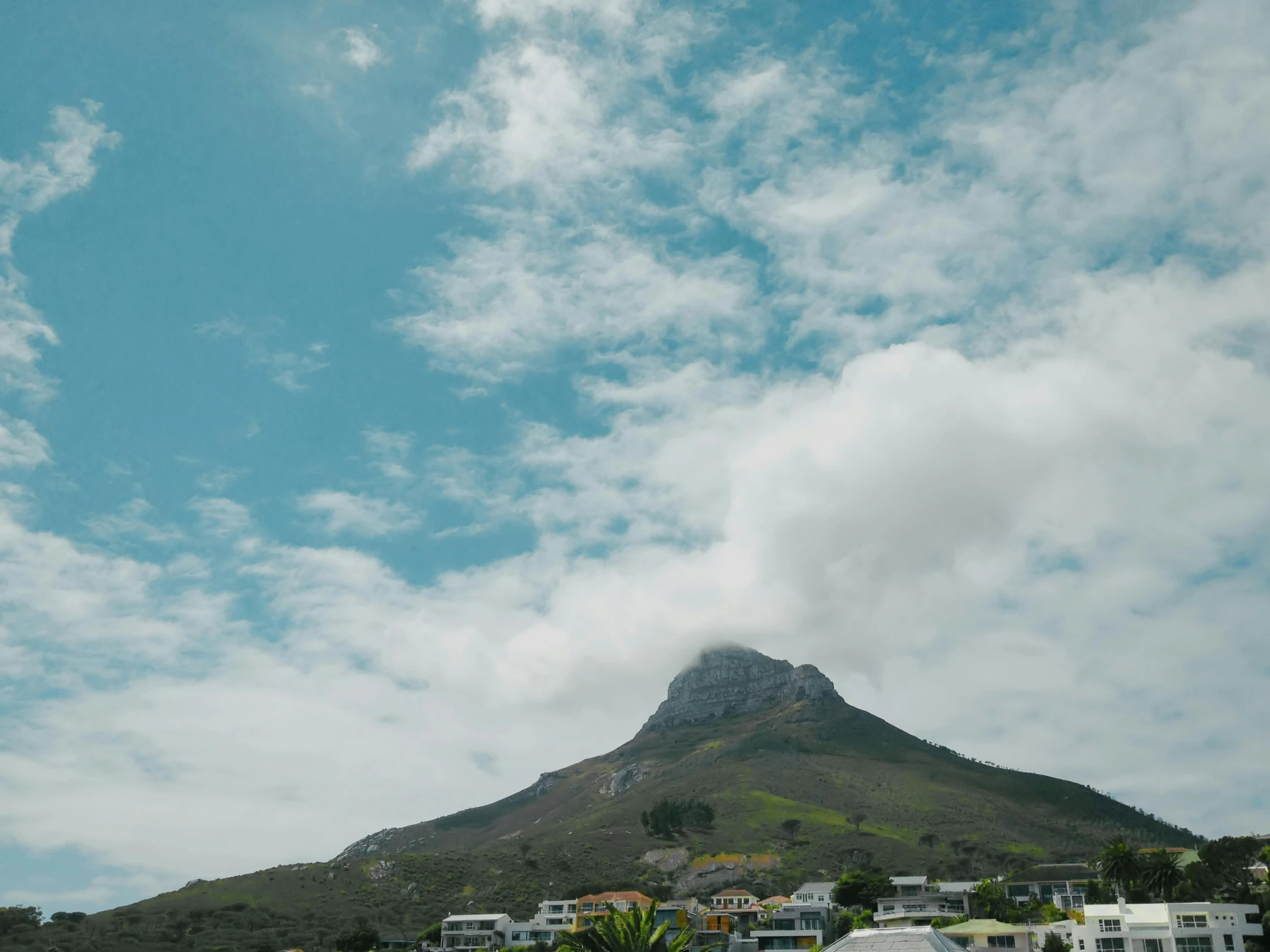 a very tall building on top of a hill