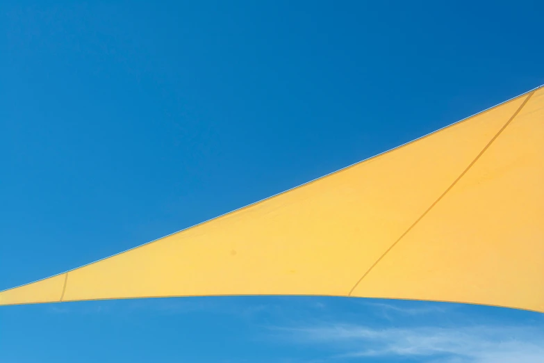 yellow sail sail with sky and cloud background