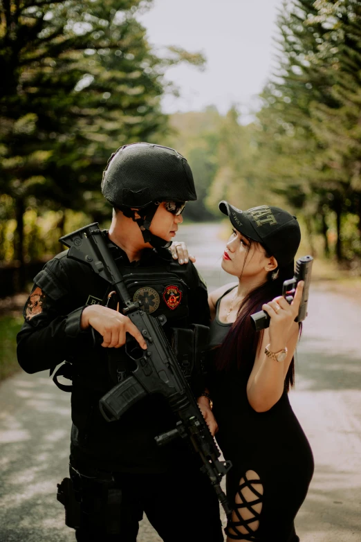 a young couple wearing police uniforms posing for a po