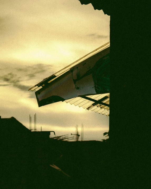 some dark structures against a cloudy sky