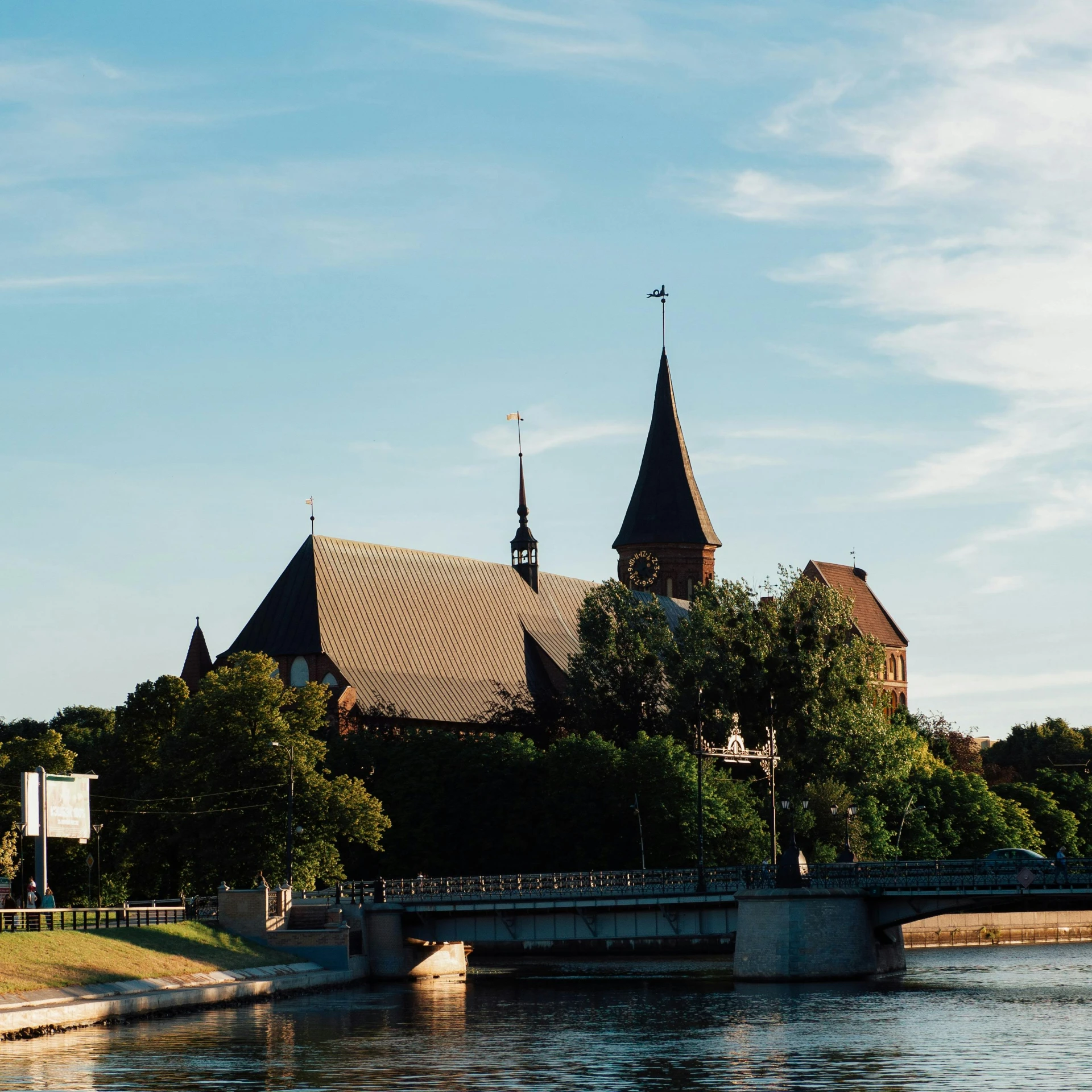 a picture of a church that is overlooking a river