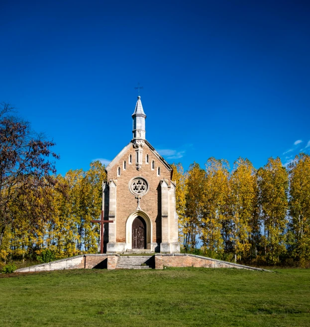 a large church with a steeple is seen