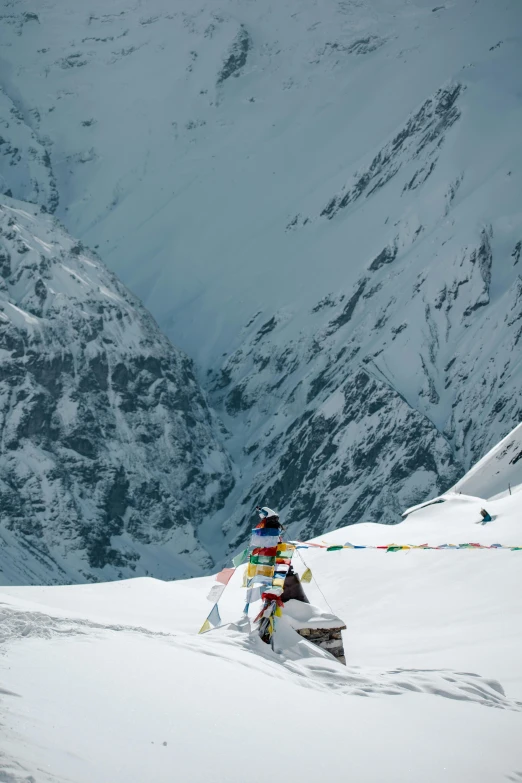 a man that is skiing down a hill in the snow