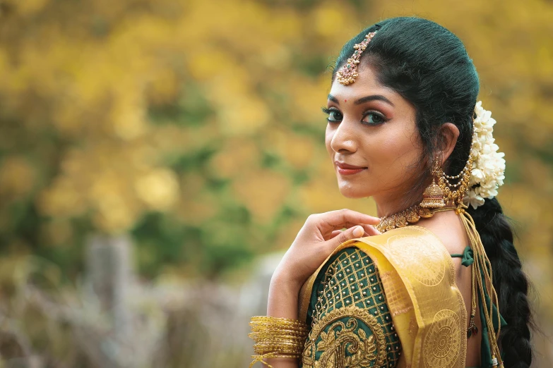 beautiful indian woman in traditional clothing posing for a picture