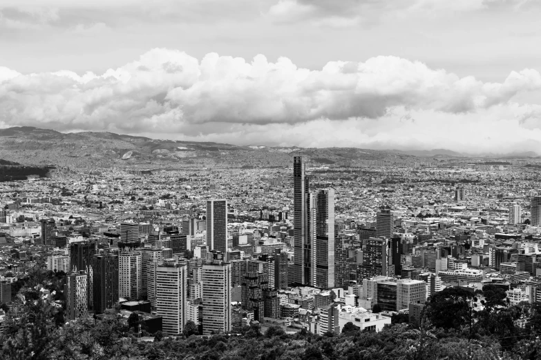 black and white pograph of a city and mountains