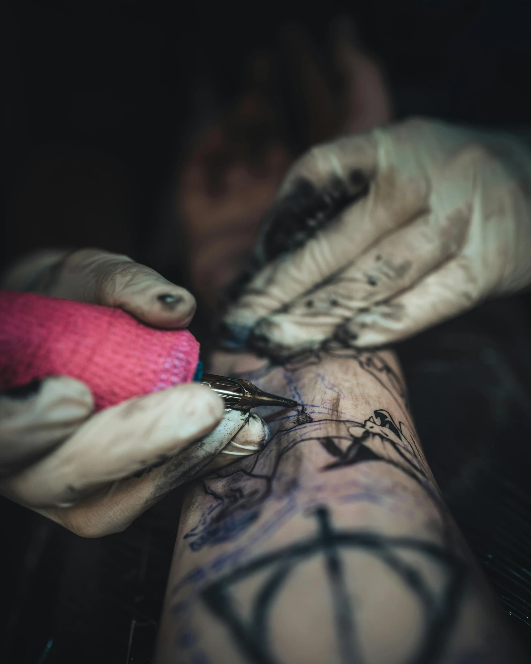 someone getting inked on someone's arm with a pen