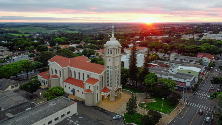 an aerial view of a city with buildings and a clock tower