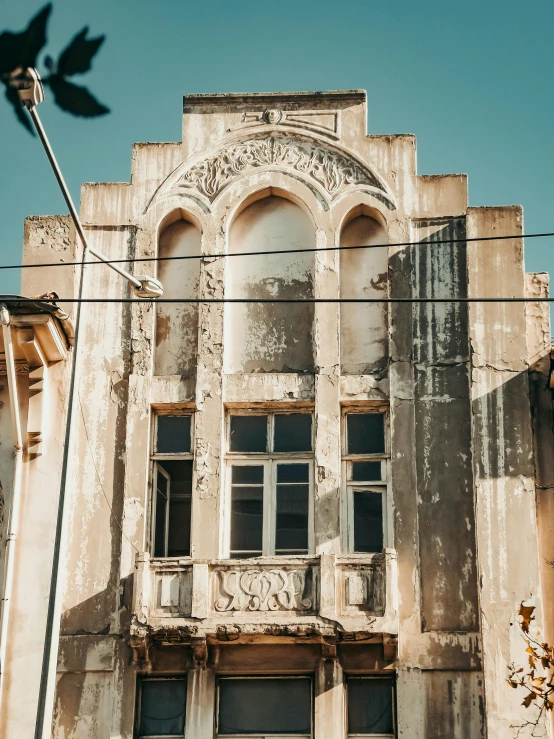 an old building with windows on the top and the front wall