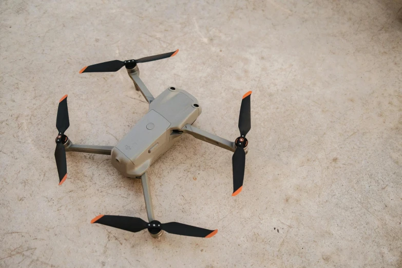 a remote controlled flying device in the sand