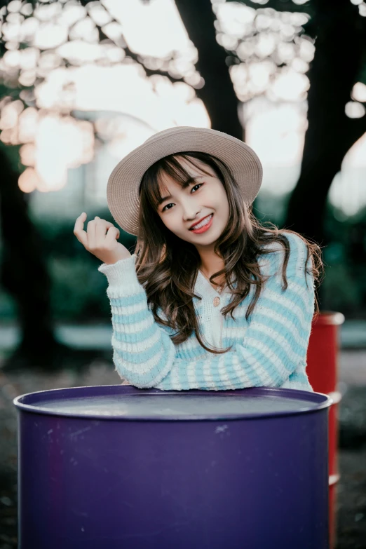 a  posing for a picture at the park