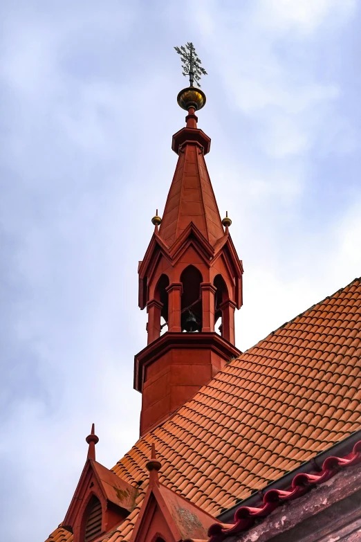 the top of the building has a bird on top